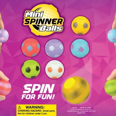 Colorful mini spinner balls in various patterns and colors, including soccer ball designs, displayed on a vibrant pink geometric background with hands spinning the toys and the text “Mini Spinner Balls – Spin for Fun!”