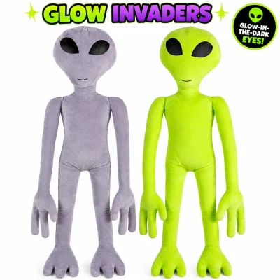19.5-inch Glow Invaders alien plush assortment featuring gray and neon green extraterrestrial stuffed toys with glow-in-the-dark eyes on a white background.