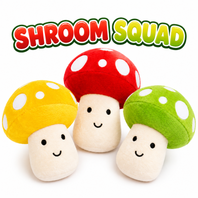 Three colorful plush mushroom toys displayed on a white background beneath a bold "SHROOM SQUAD" title. Features red, yellow, and green smiling mushroom plush characters with soft velour-style caps and cute embroidered faces. Ideal for claw machines, arcade prizes, redemption counters, novelty gift shops, and mushroom-themed plush collections.