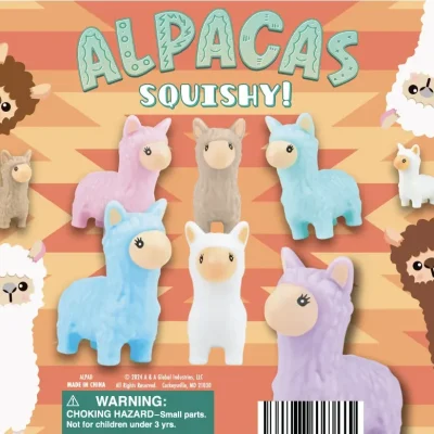 Colorful display card for "Alpacas Squishy!" toy collection featuring soft, cartoon-style alpaca figurines in pastel shades of pink, blue, purple, white, and beige. The alpacas are arranged on an orange zigzag background with playful illustrated alpacas peeking in from the corners. The display includes a warning for small parts and is designed for a fun, kid-friendly presentation.