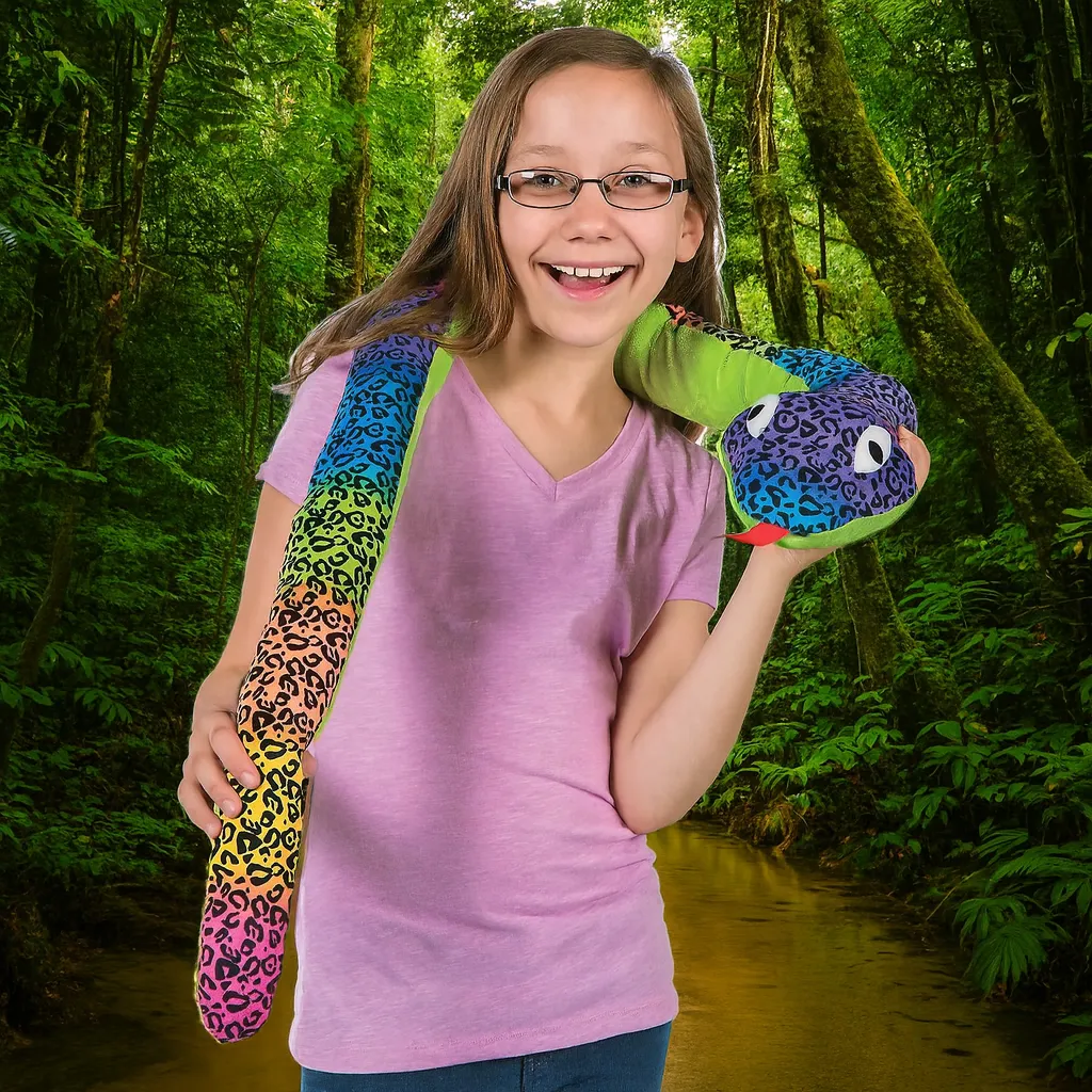 Child holding a giant leopard-pattern plush snake in a lush jungle setting.