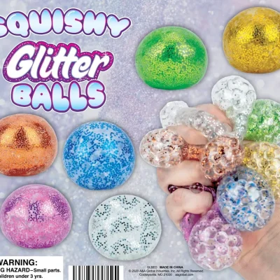 "Assorted Squishy Glitter Balls in various colors including green, gold, pink, blue, and silver, displayed against a sparkly background. A hand is shown squeezing several clear glitter-filled balls, demonstrating their squishy, tactile texture. Text reads 'Squishy Glitter Balls' in playful bubble lettering."