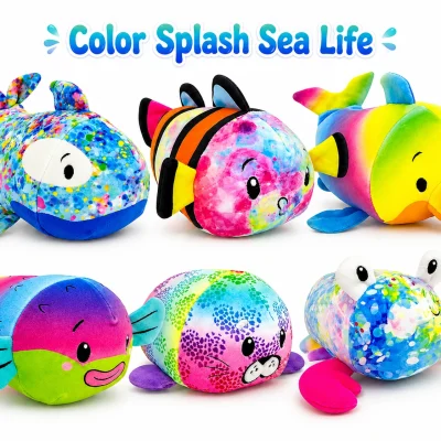 Color Splash Sea Life plush assortment featuring six colorful ocean-themed stuffed animals including a whale, clownfish, dolphin, fish, seal, and crab on a white background with a Color Splash Sea Life title above.