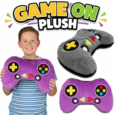 Game On Plush game controller pillows featuring gray and purple gaming controller plush cushions with child holding oversized controller for size comparison, 16 x 10 inch assorted plush prize for claw machines, arcades, carnivals, and game rooms.