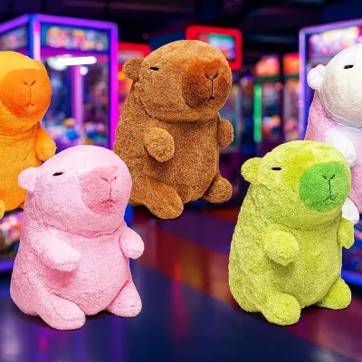 Five colorful capybara plush toys in an arcade setting, posed in front of vibrant claw machines under neon lighting.