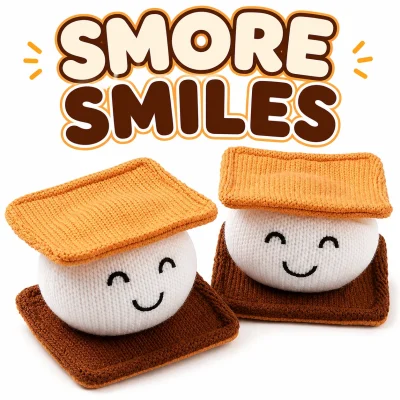 "SMORE SMILES plush toy promotional image featuring two smiling knitted s'mores plush characters on a clean white background with a warm brown and graham-cracker colored title above. Cute campfire-themed kawaii design for crane machines, claw machines, redemption counters, and gift shops."