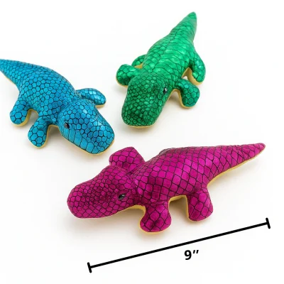 Three shiny 9-inch plush alligator toys in green, blue, and magenta arranged on a white background with a measurement line below.