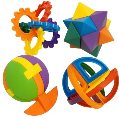 “Colorful interlocking plastic brain teaser puzzles including gears, star, and sphere designs on a white background.”