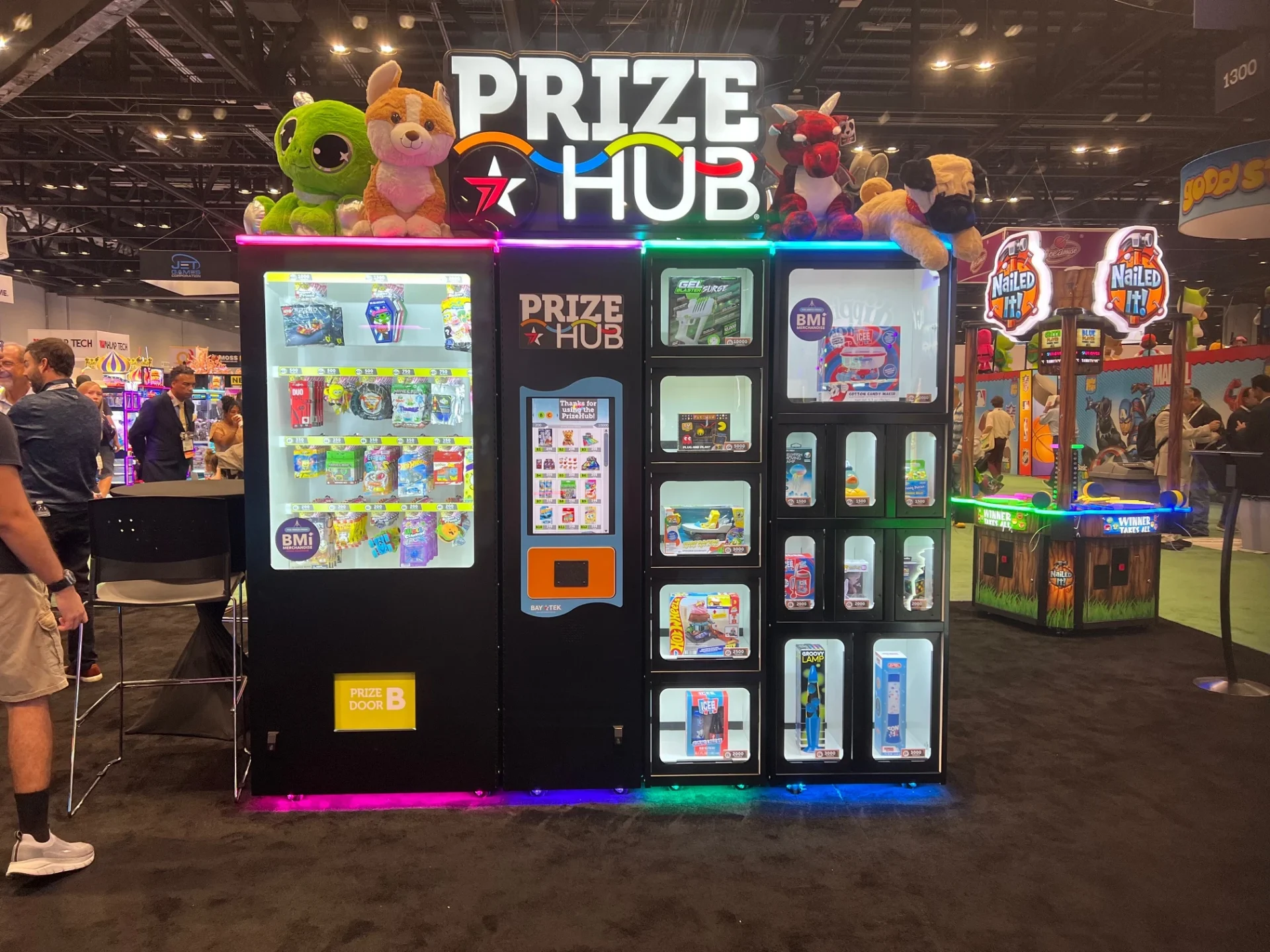 Automated redemption prize display with electronics, hanging prizes, and locker-ready rewards