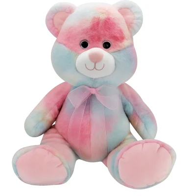 pastel sherbet teddy bear plush with pink blue and yellow tie-dye fur and a pink ribbon on a white background