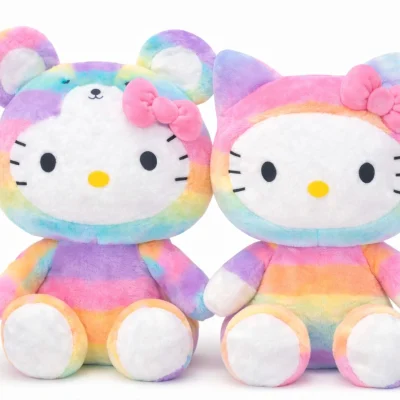 Rainbow Hello Kitty plush toys side by side, two pastel multicolor Hello Kitty stuffed animals with bow, soft plush texture on white background