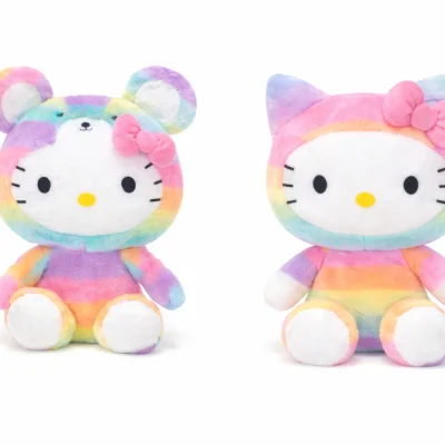 Rainbow Hello Kitty plush toys showing two styles side by side, one wearing mouse ears and one with standard Hello Kitty ears, seated on a white background