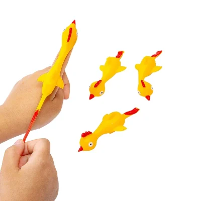 Flying rooster flinger toys made of stretchy vinyl, shown being launched by hand, bulk novelty prizes for vending machines and arcades