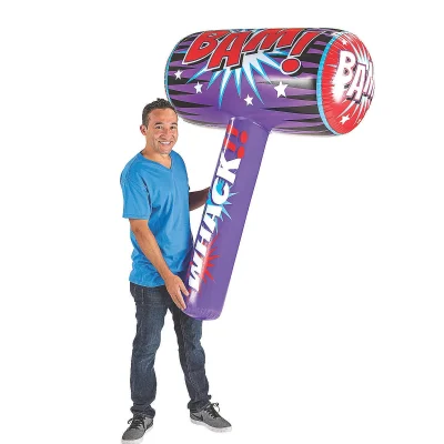 Adult holding giant inflatable mallet toy showing oversized scale and comic BAM design