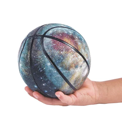 Mini Inflatable Outer Space Rubber Basketball Held In Hand Showing Size And Galaxy Design