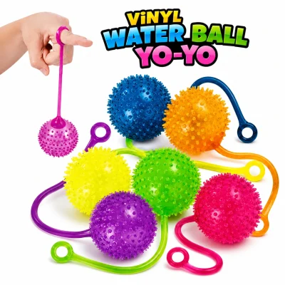 Assorted vinyl water ball yo-yo toys with stretchy loops in bright translucent colors, displayed with a hand demonstrating play on a white background for vending machines, prize redemption, party favors, and novelty toy displays.