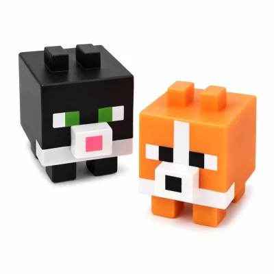 Pixel style cube animal toys featuring black cat and orange fox block figures with square faces and bright colors, arcade prize toys for vending and redemption games.