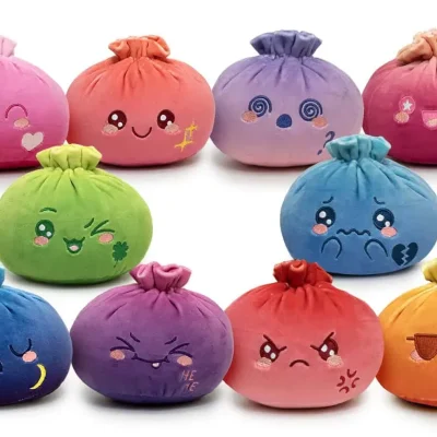 Assorted colorful dumpling plush toys with embroidered faces